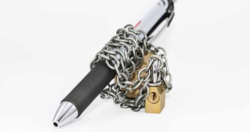 Pen with a chained and padlock in an isolated bacground