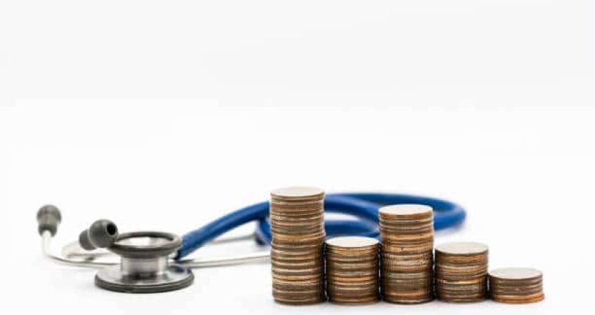 Stethoscope on stack of coins, concept of Financial Health